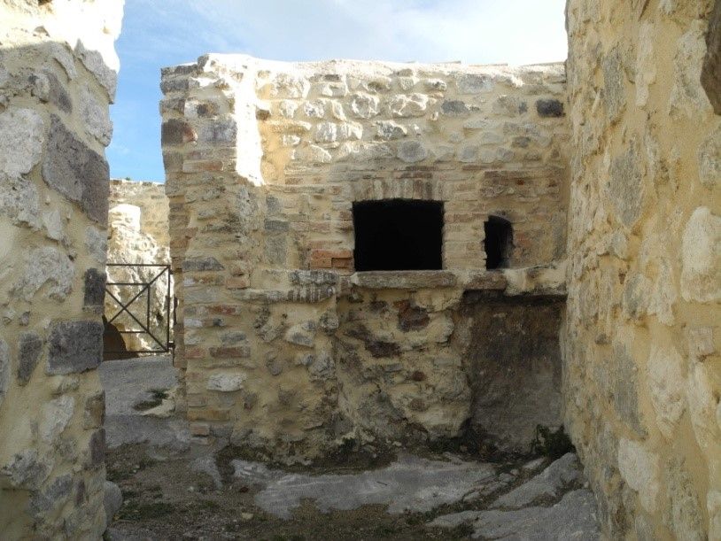 The round oven with its small brick dome, cut into the rock